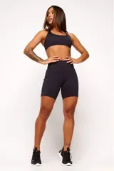 Top deportivo negro con diseño nadador, entrada para almohadillas removibles, bolsillo trasero y detalle reflectivo.