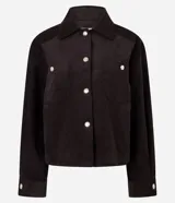 Campera Marfinno de pana marrón oscuro, con cuello clásico, cierre frontal de botones metálicos dorados, bolsillos frontales con solapa y manga larga con puños abotonados.