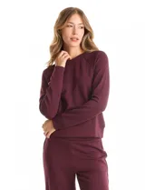 Conjunto de dos piezas compuesto por un buzo de cuello redondo con mangas raglán y un pantalón de pierna ancha con cintura elástica. Confeccionado en tejido de tacto suave con puños y cintura en rib elástico.