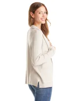 Cardigan tejido color beige, marca Elie Tahari, con cuello con solapa, bolsillos delanteros aplicados y ruedo de manga con dobladillo.