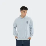 Canguro con capucha de estilo urbano, color celeste con efecto lavado. Presenta un estampado circular pequeño en el pecho con el logo de Reef Surf Co. y bolsillo tipo canguro frontal.