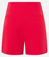 Short de sastrería negro, tiro alto, con cierre frontal de botones visibles.