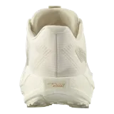 Championes de running todoterreno Salomon Aero Blaze 3 Grvl, color beige claro con detalles en naranja y suela adherente.