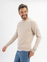 Buzo de punto con escote en V, de manga larga y diseño clásico, con puños y ruedo acanalados.