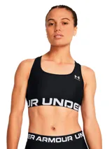 Top deportivo Under Armour de soporte medio, color negro con banda elástica inferior con logo de la marca en blanco. Diseño tipo jersey con espalda cruzada y tejido HeatGear de secado rápido.
