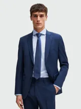 Corbata azul oscura con diseño geométrico de pequeños puntos claros.
