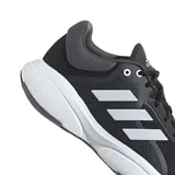 Championes de running Adidas Response, color negro con las icónicas tres tiras laterales en blanco y suela con tecnología Bounce para mayor amortiguación.