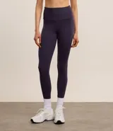 Calza legging deportiva de poliamida color azul con cintura alta de 10 cm.