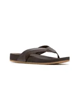 Sandalias tipo ojota de cuero marrón con tiras anchas y suela de goma antideslizante.
