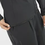 Campera Salomon Essential Lightwarm Hybrid para mujer, de color negro con cierre completo y cuello alto. Combina tejido ripstop y forro polar para mayor calidez y transpirabilidad.