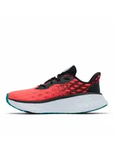 Championes de trail running Columbia Konos Elevate, color salmón y negro con suela blanca y detalles en turquesa. Diseñados con tecnología Omni-MAX y Techlite+ para mayor amortiguación, estabilidad y tracción en todo tipo de terrenos.