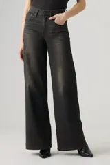 Jean de tiro alto con diseño wide leg, color negro con efecto deslavado, confeccionado en denim con bajo nivel de elasticidad.
