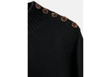 Vestido corto de punto en color negro, con cuello alto y manga larga. Presenta un diseño minimalista y ajustado.
