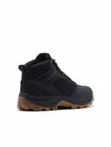 Bota de trekking Columbia modelo Transverse Hike, de color negro con suela de caucho marrón, confeccionada en malla y piel con tecnología impermeable y transpirable.