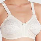 Soutien reductor sin aro color blanco, con copas reforzadas y detalle de puntilla. Confeccionado con tela que contiene fibra LYCRA®. Breteles anchos elásticos regulables.