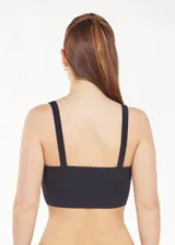 Bralette de tela acanalada color negro, con escote recto y tirantes anchos.