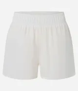 Bermuda deportiva Get Over modelo runner color beige, con cintura elástica, bajo redondeado y aberturas laterales. Cuenta con un pequeño bolsillo funcional trasero.