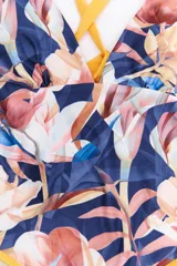 Malla enteriza con estampado animal print tipo cebra en tonos bordó y negro, con breteles cruzados en la espalda y bordes en color celeste.