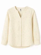 Blusa color arena de lino con bordados de pequeños círculos, corte recto, cuello mao y mangas largas.