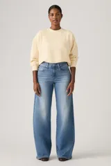 Jean de tiro alto y corte wide leg en color azul con efecto deslavado. Confeccionado en mezcla de algodón, poliéster y elastano, de elasticidad baja.