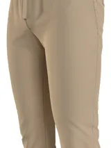 Pantalón de jogging color beige, corte slim, con cintura elástica ajustable con cordón, bolsillos laterales y logo de Tommy Jeans bordado en la parte trasera.