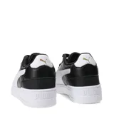 Championes urbanos Puma modelo Shuffle Downtown, color negro con detalles en blanco. Presentan una silueta clásica con logo de la marca en dorado en el lateral y suela de goma blanca.