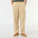 Pantalón de corte holgado color beige, de estilo casual con cintura elástica.