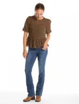 Blusa peplum de Nanette con estampado de círculos, cuello redondo, mangas cortas con frunces y musculosa interna a tono.