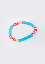 Pulsera elastizada con mostacillas de colores y detalles en aleación de metales.