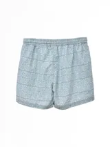 Short de baño azul con estampado de motivos marinos en celeste.