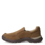 Zapato tipo mocasín Caterpillar Threshold Slip On Canvas, color marrón claro (beige natural), con capellada de lona y elásticos laterales para calce fácil. Suela gruesa y robusta de goma color marrón oscuro.