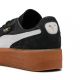 Championes Puma modelo Palermo Elevata, de color negro con detalles en blanco y suela de plataforma color caramelo. Confeccionados en gamuza con el logo de la marca en dorado.