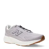 Championes deportivos New Balance modelo Ctlyst, color gris con entresuela blanca y suela de goma color caramelo. Presentan diseño de malla transpirable con refuerzos sintéticos y el logo N característico en el lateral.