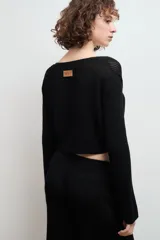 Cardigan celeste de tejido de punto con escote en V y lazo de ajuste frontal.