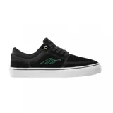 Championes de skate Emerica modelo The Hoban, color negro con detalles en verde y suela blanca. Presentan un diseño de perfil bajo con costuras reforzadas en la puntera y ojal superior metálico dorado.