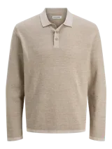 Polo de manga larga con fit relajado, confeccionado en tejido de punto con textura estructurada. Presenta cuello clásico con cierre de botones y hombros caídos.