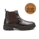 Bota Chelsea de cuero color marrón oscuro, con elásticos laterales y suela track.
