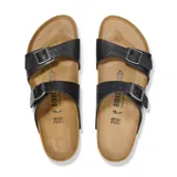 Sandalia Birkenstock modelo Sydney con dos correas ajustables de material sintético Birko-Flor en color negro. Presenta plantilla anatómica de corcho y látex, con suela de EVA antideslizante.