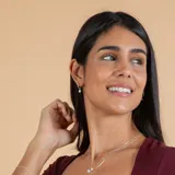 Aros tipo argolla pequeña en plata 925 con dije colgante de circonia en engarce inglés.