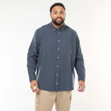 Camisa de manga larga en tejido oxford color azul, de corte recto, con cuello abotonado y cierre frontal de botones.