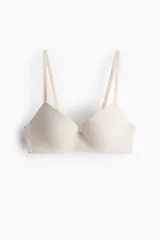Soutien push-up de microfibra color beige con copas acolchadas con aros, breteles ajustables y diseño liso.