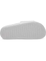 Sandalias Under Armour de mujer, modelo W Armour Slide, en color blanco con el logo de la marca en un tono tornasolado morado. Cuentan con correa sintética con forro de espuma y plantilla anatómica.