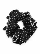 Colaless de encaje negro con diseño translúcido y tiras laterales ajustables.