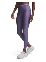 Calza deportiva Under Armour de la línea HeatGear, color violeta, con cintura elástica de tiro medio con logo de la marca y logo reflectante en el muslo.