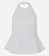 Blusa de bengalina con diseño peplum, escote halter y espalda descubierta. Presenta un corte estructurado que se ajusta al cuerpo y se ensancha en la cintura.