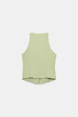 Top halter negro confeccionado en mezcla de lino, con cierre frontal mediante lazadas y forro interior a tono.