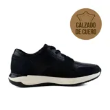 Zapato de vestir acordonado, color negro, con detalles de cuero texturizado en el empeine y laterales. Suela blanca con base negra.
