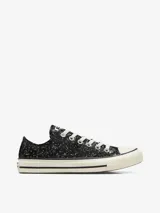 Zapatillas Converse Chuck Taylor All Star Lift con plataforma, color negro con glitter y cordones blancos.