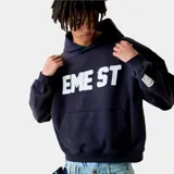 Hoodie oversize color azul marino con capucha, bolsillo canguro y estampado frontal en blanco con la frase "EME ST".