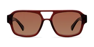 Lentes de sol estilo aviador oversize con montura de acetato color marrón y lentes polarizadas en tono marrón.